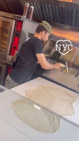 Stretching feteer dough by hand